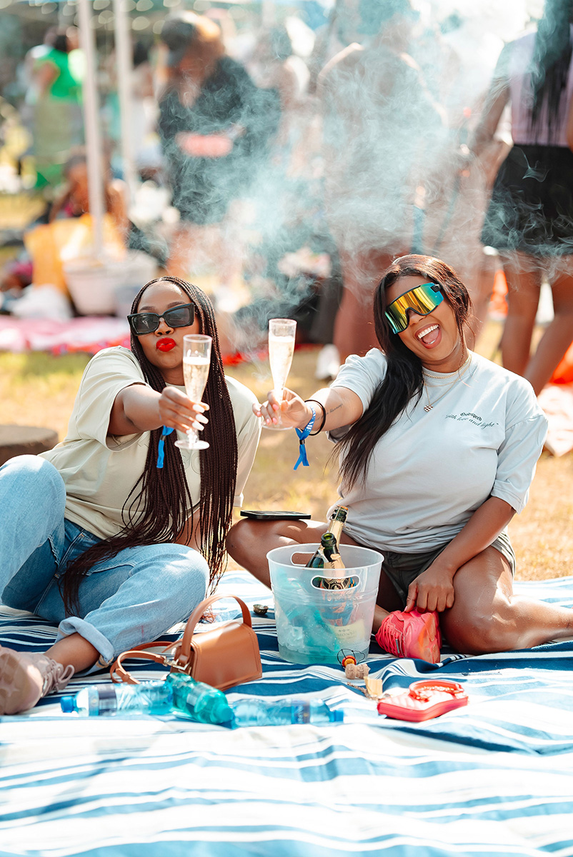 Girls sitting on picnic blankets
